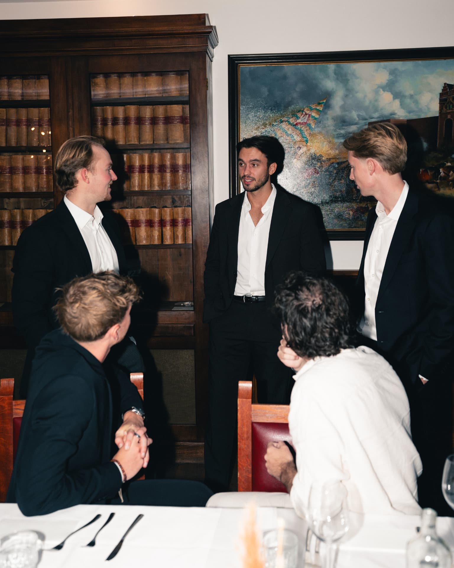 TNS members in black tie at a private dinner